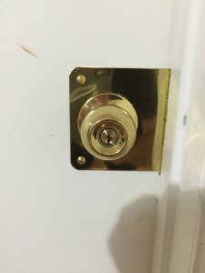 Door repaired with a Door Reinforcer Plate and new lock