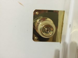 Door repaired with a Door Reinforcer Plate and new lock